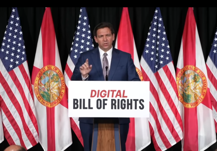 Florida Governor Ron DeSantis speaking at a podium